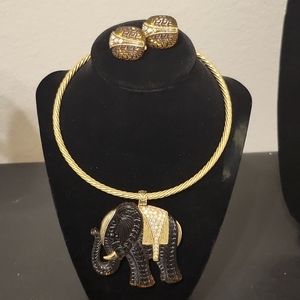 Vintage gold toned elephant necklace with matching earrings